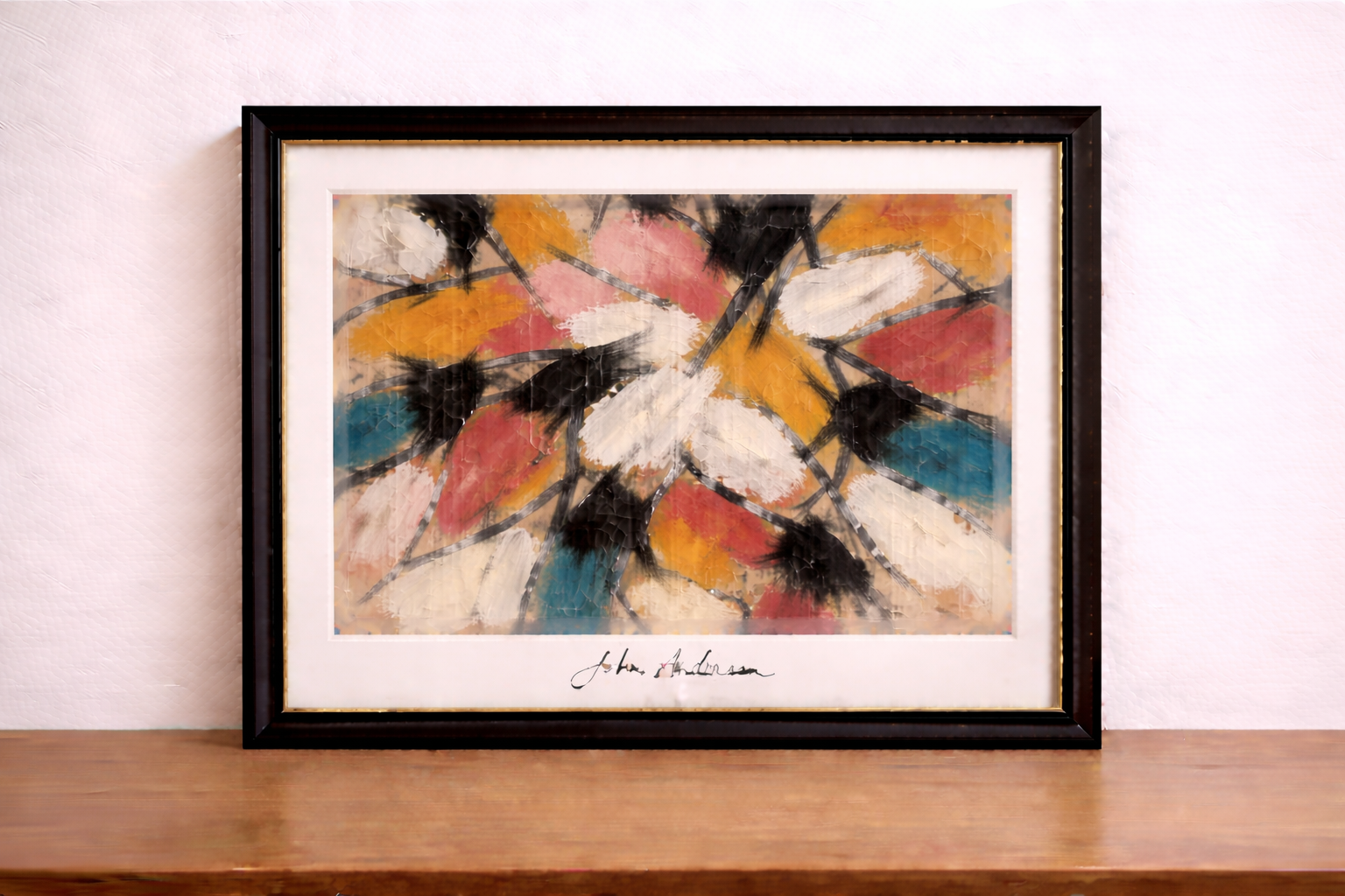Framed abstract expressionist painting on wall